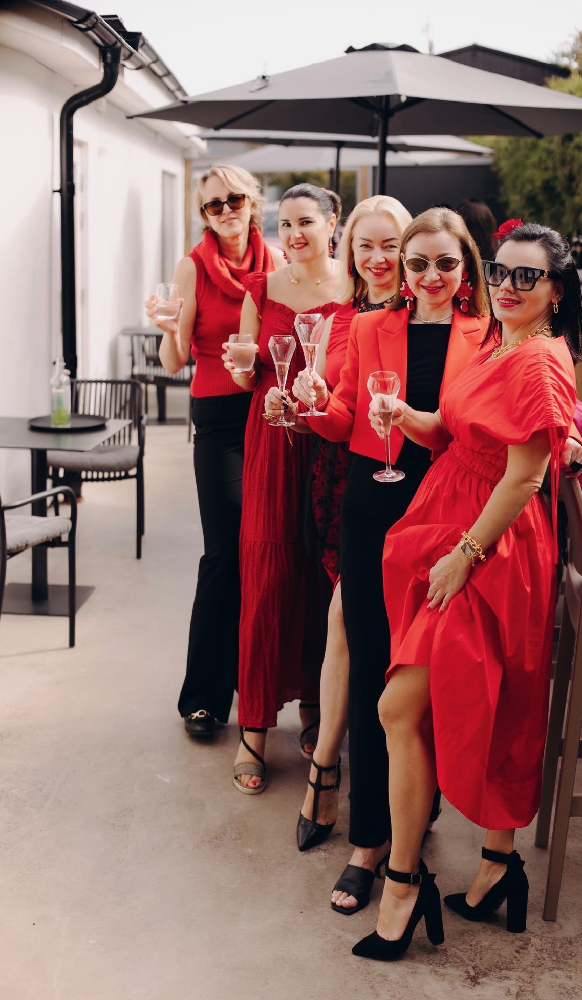 Diverse women coworkers sharing ideas, laughing, and building strong relationships during a casual meeting, reflecting teamwork, inclusion, and the positive dynamics of a modern workplace